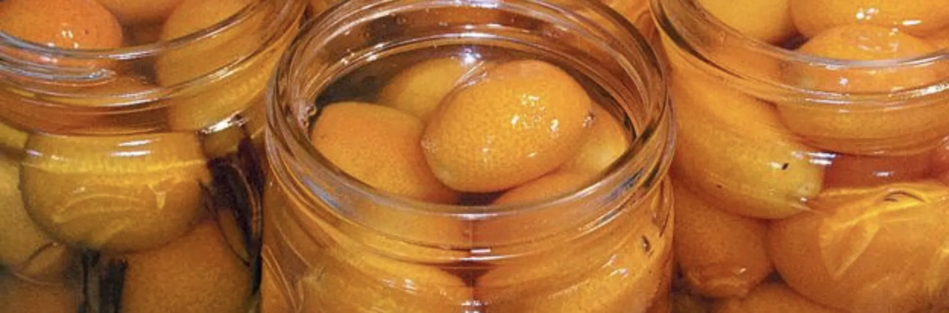 6 glass jars of whole kumquats and cinnamon sticks