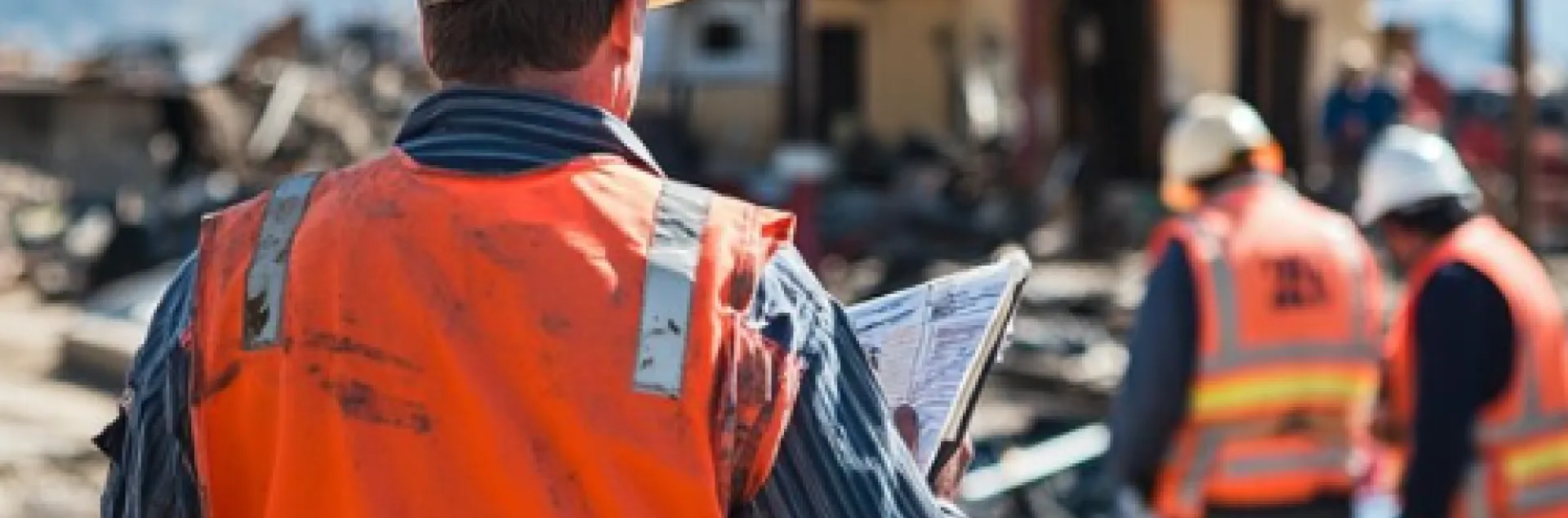 disaster workers assessing a site after a fire