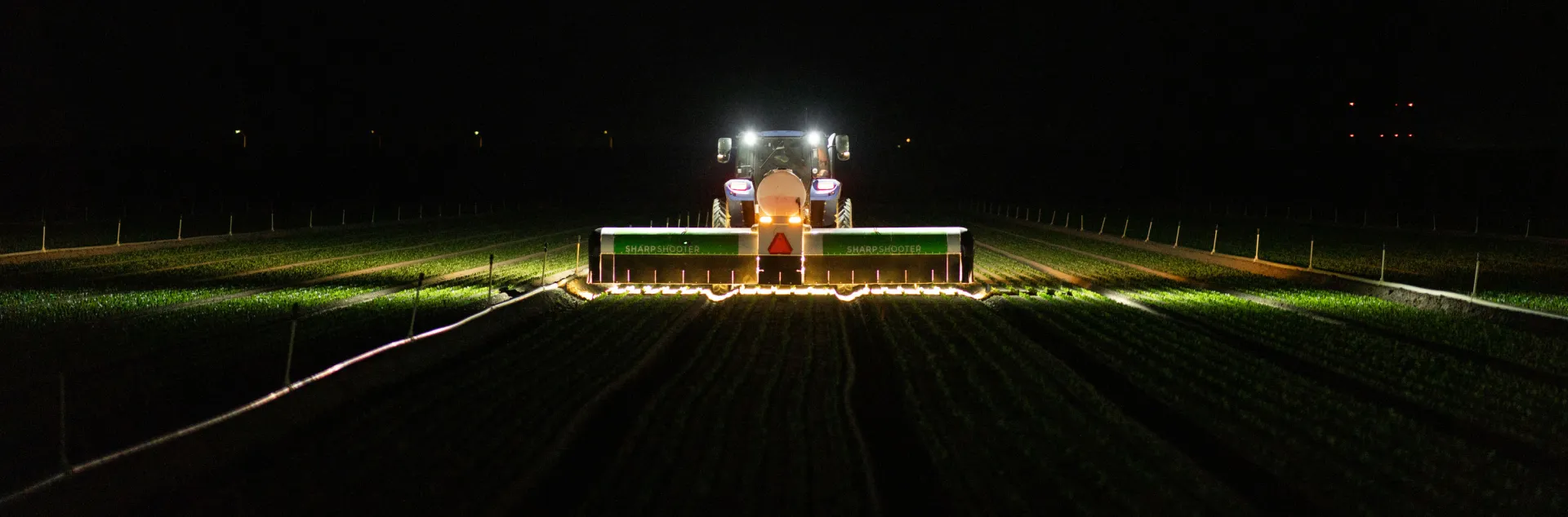 AI-powered precision application aims individual micro-shots at weeds or crops during nighttime