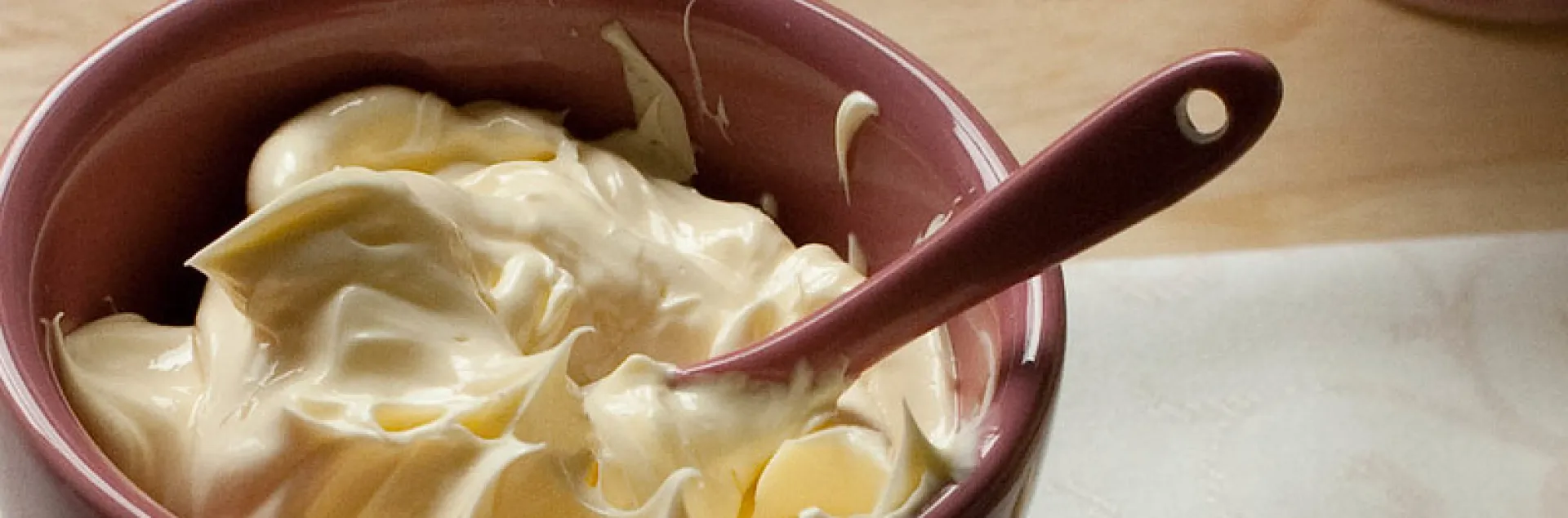 Whipped butter in bowl with spoon.