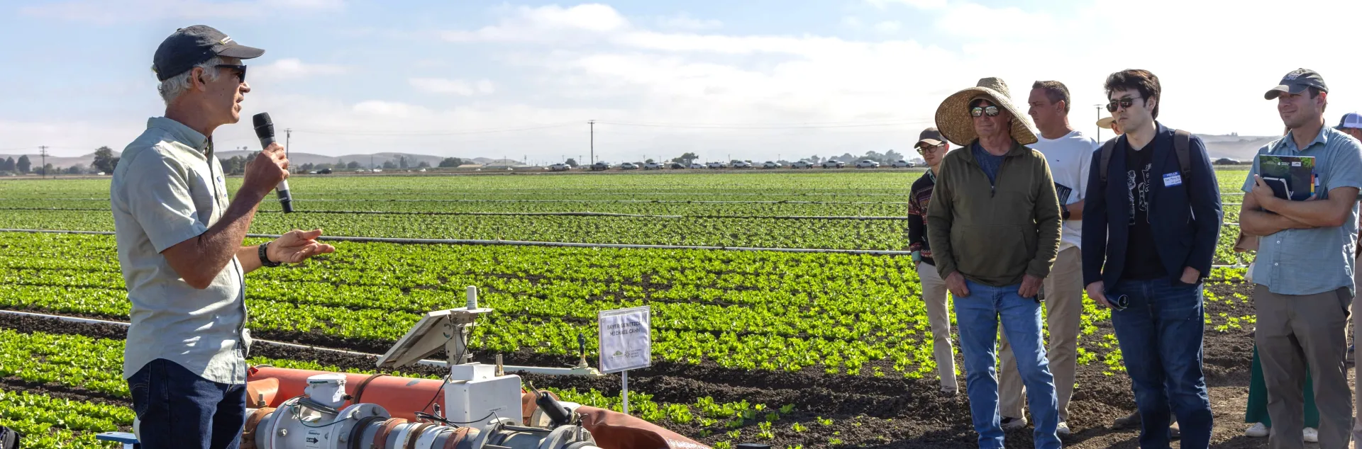 A field-day presenter explains irrigation technology to growers and agricultural professionals during UC ANR Innovate's Coastal Veg Field Day