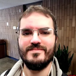 Profile photo of man with glasses and beard