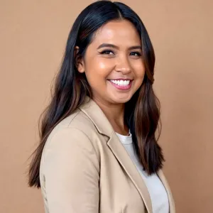 Headshot picture in beige blazer and white tshirt