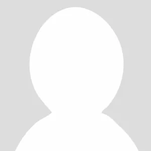 outline of a person's head and shoulders with no face indicating no photo available