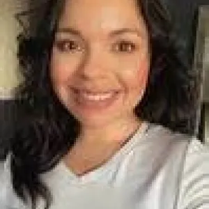 woman with black hair and white shirt