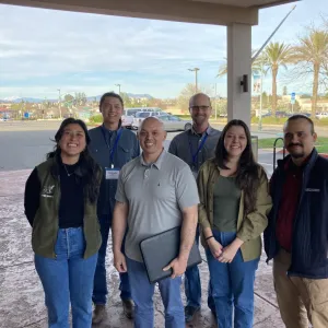 staff smiling at camera