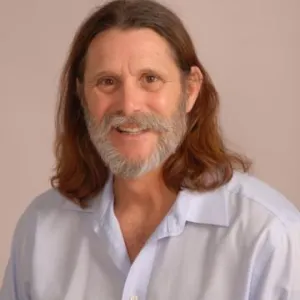 A smiling Master Gardener in a light blue shirt.
