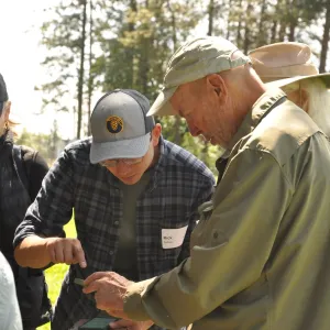 UC ANR Forest Advisor Rick Satomi assists students during a forest mapping exercise.