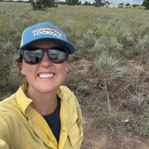 Lenya in fire clothes in the field.