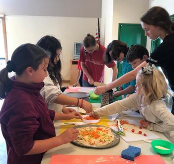 Making healthy pizzas with produce from our gardens.