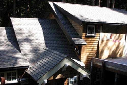 Complex roof design with wood shingle siding