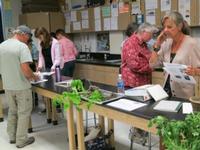 People in a classroom learning about gardening