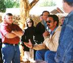Steve Rombach discusses his operation with tour participants gathered in the farm's pavilion.