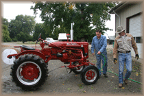 Tony Cristler and Al Bonin with restored tractor.